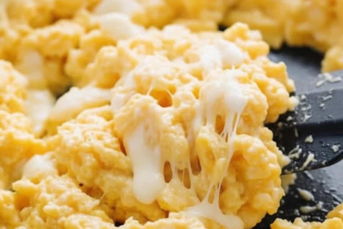 Once the eggs are custard-like and just cooked, remove from the heat and fold in the shredded mozzarella until melted and gooey. - 9