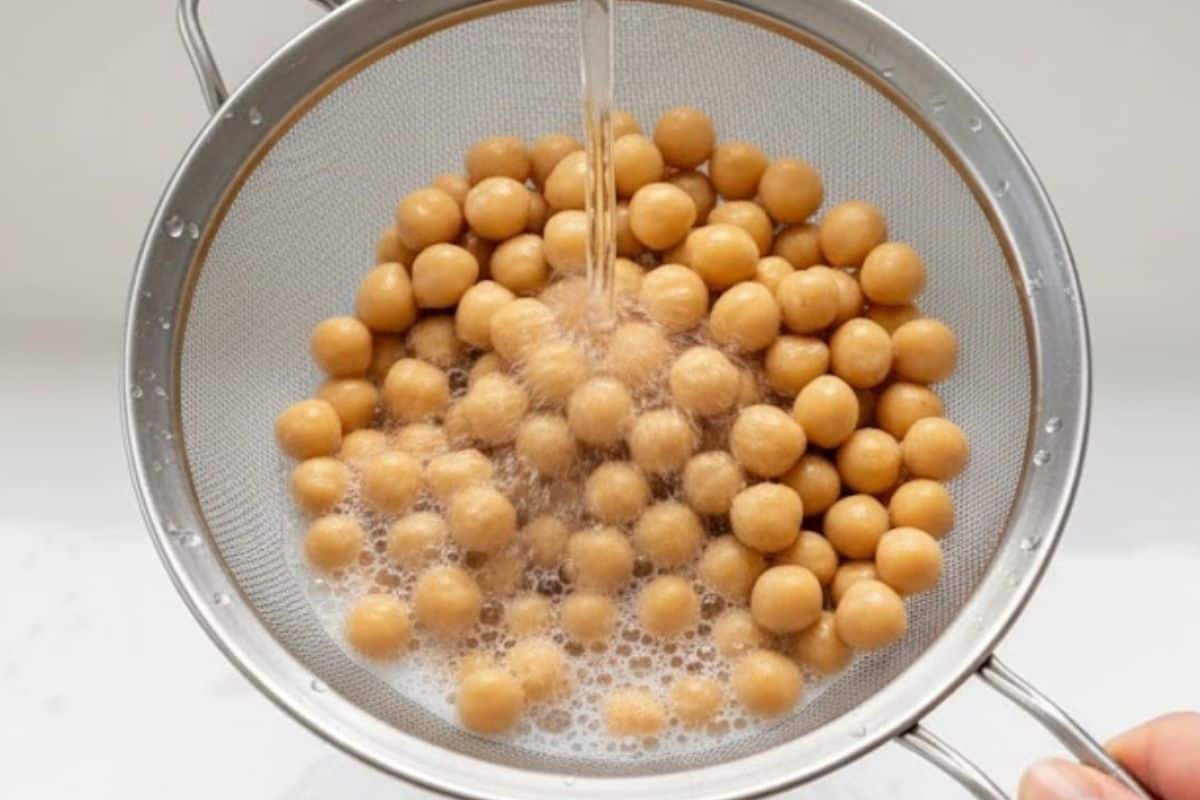 Drain chickpeas in a fine mesh strainer and rinse under cool running water until it runs clear, about 20 seconds.