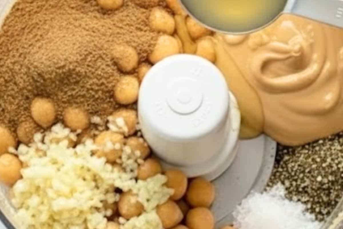 Transfer to a food processor along with tahini, lemon juice, oil, garlic, cumin, salt, and pepper. Process until smooth, scraping down sides when needed.