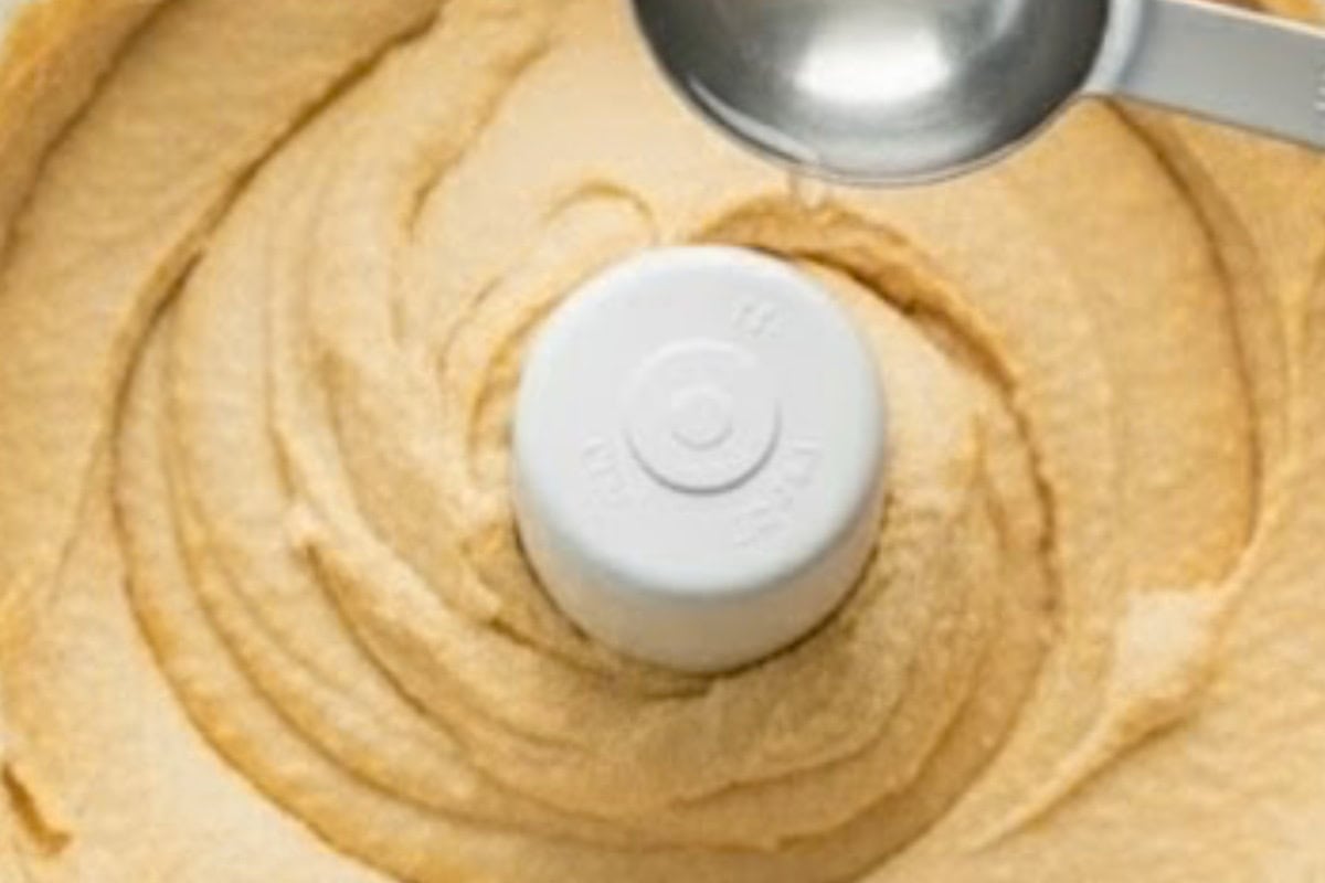 With the food processor running, slowly drizzle in 2 tablespoons of ice-cold water.