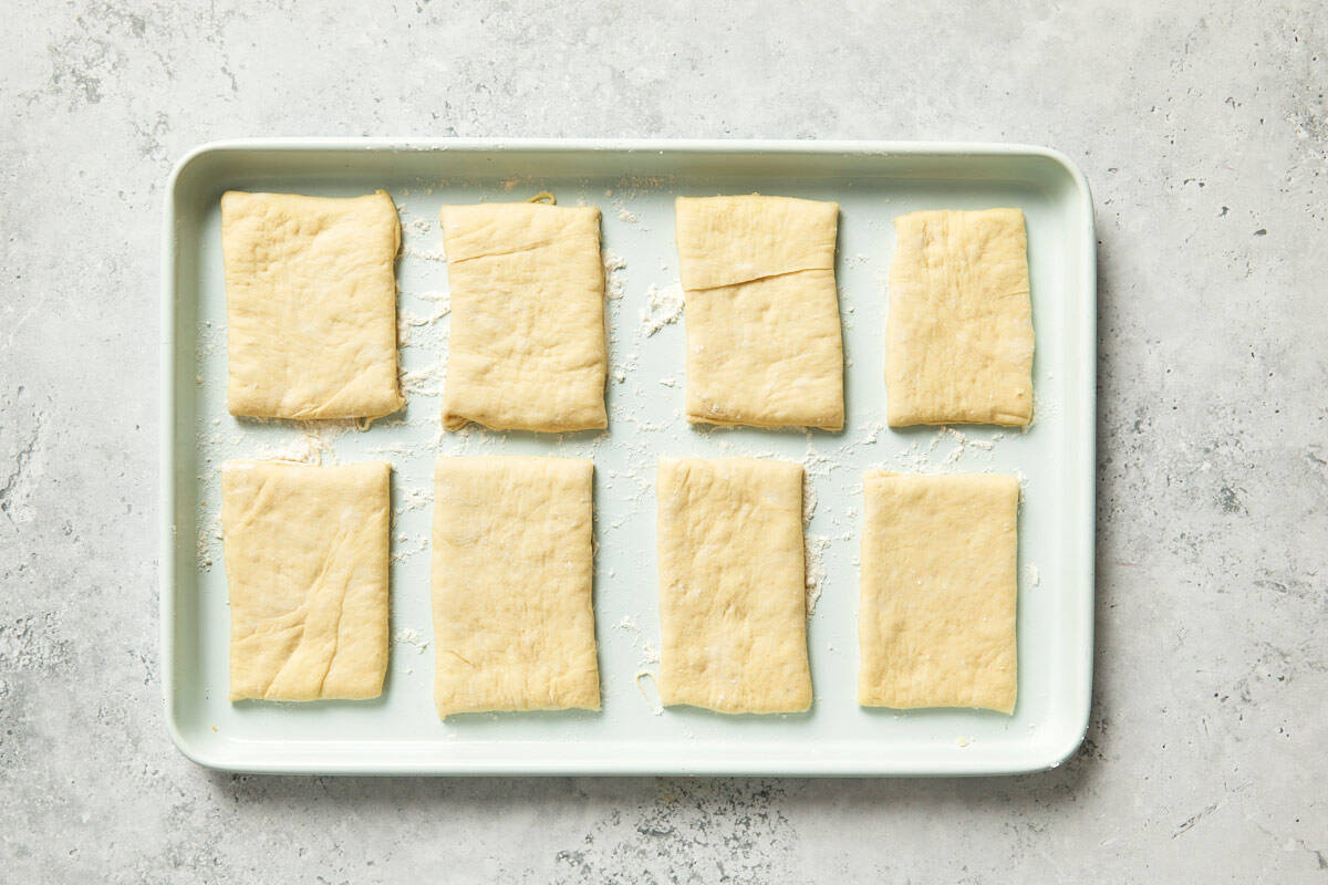 Rolled-out dough cut into even rectangles.