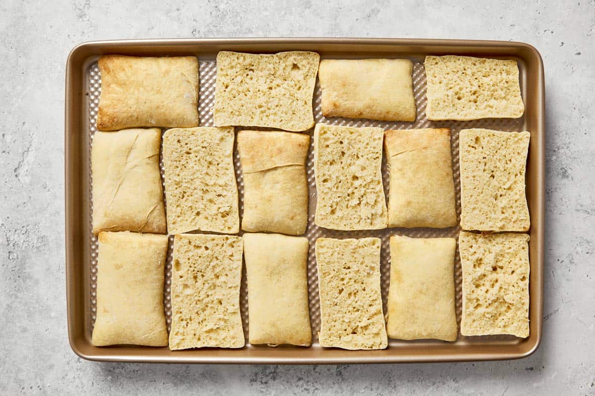 Thinly sliced Spanish flatbread after a second bake.