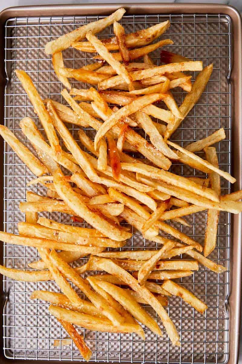 top down shot of crispy fries on a tray