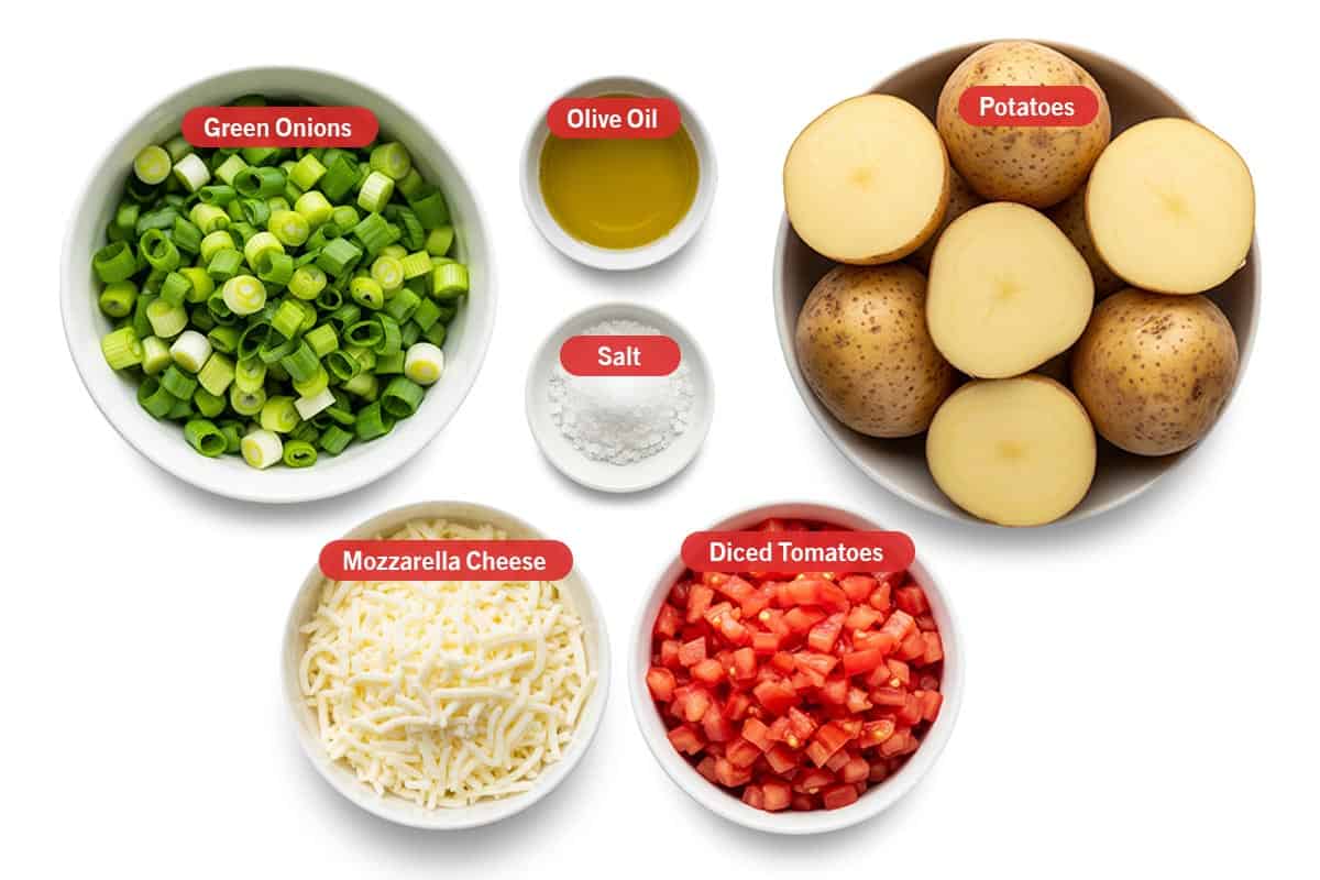 Top shot of ingredients: Green onions, olive oil, salt, Potatoes, mozzarella cheese, diced tomatoes.