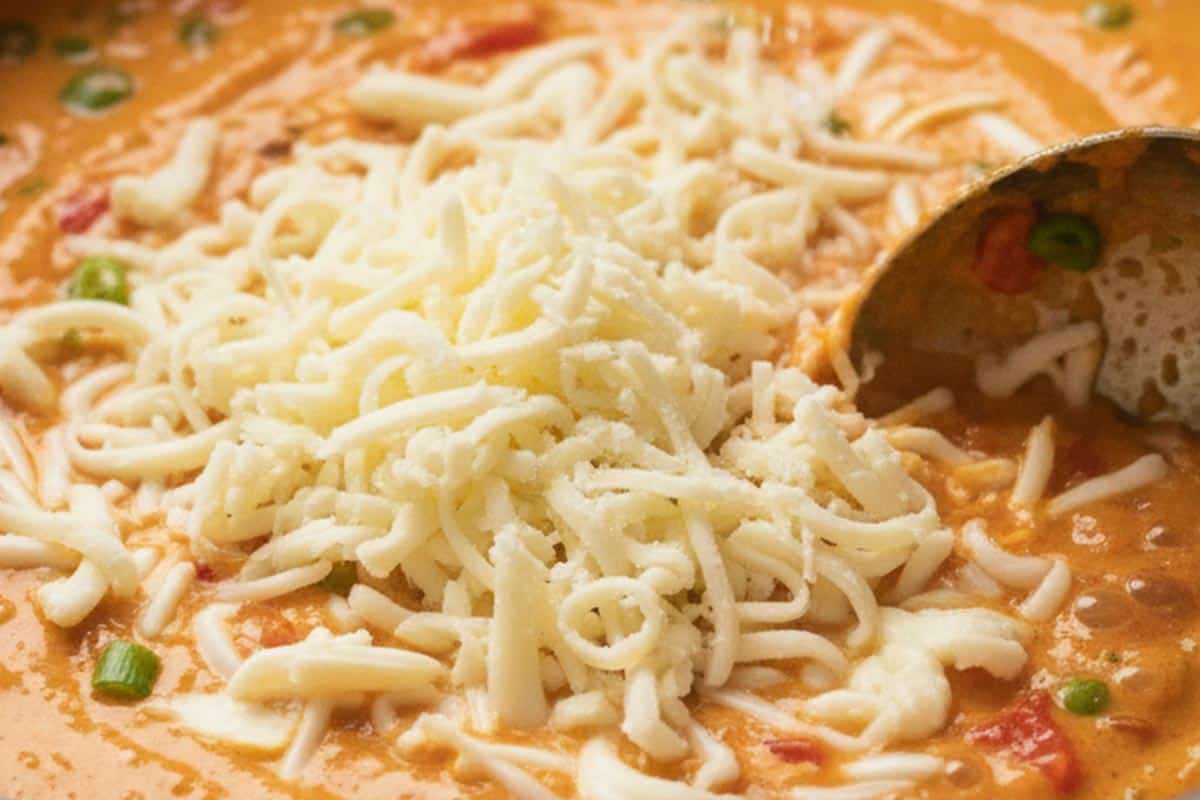 Added the shredded mozzarella to the saucepan.