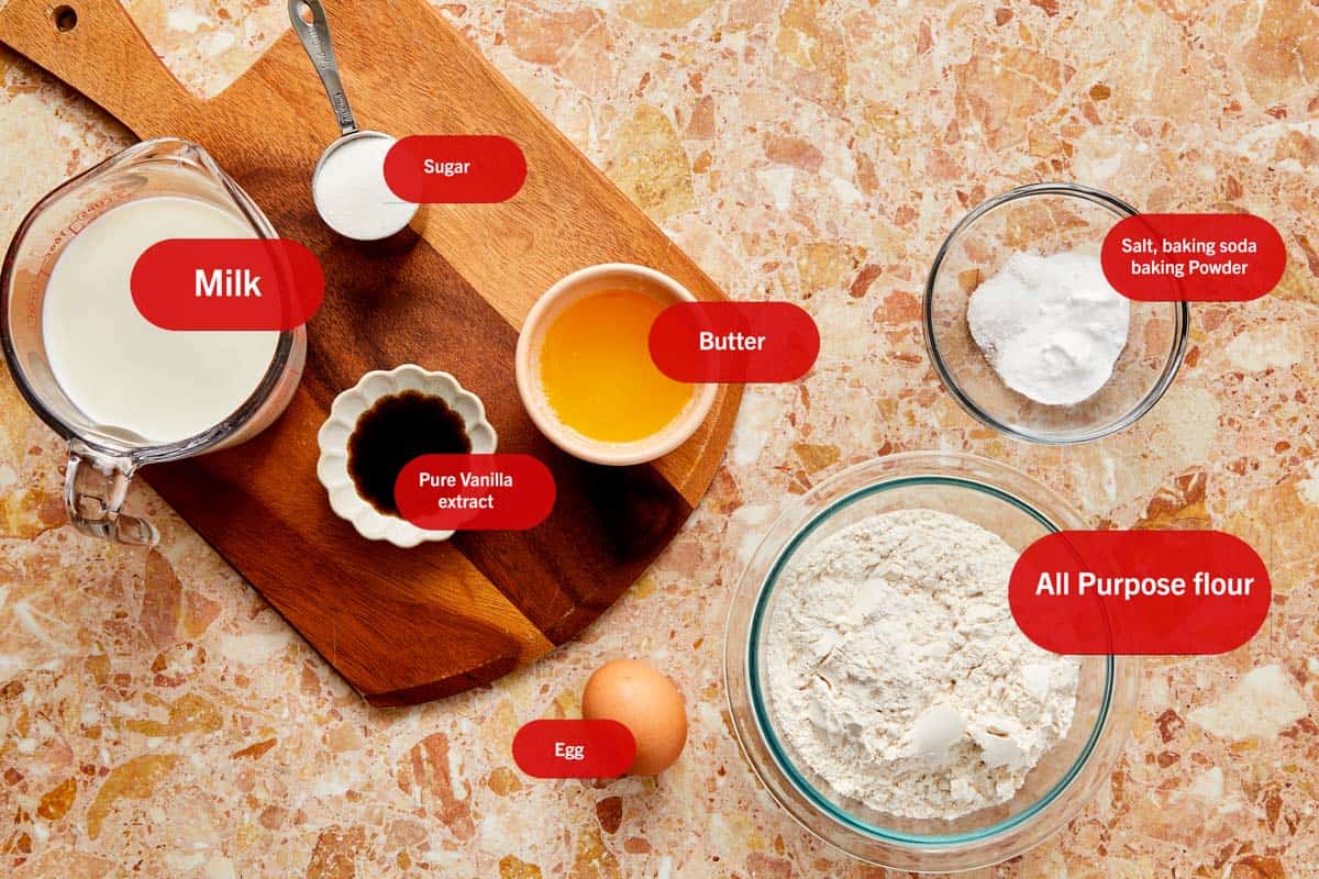 Ingredients for Wancakes displayed on a table, including flour, sugar, eggs, and butter, ready for baking.
