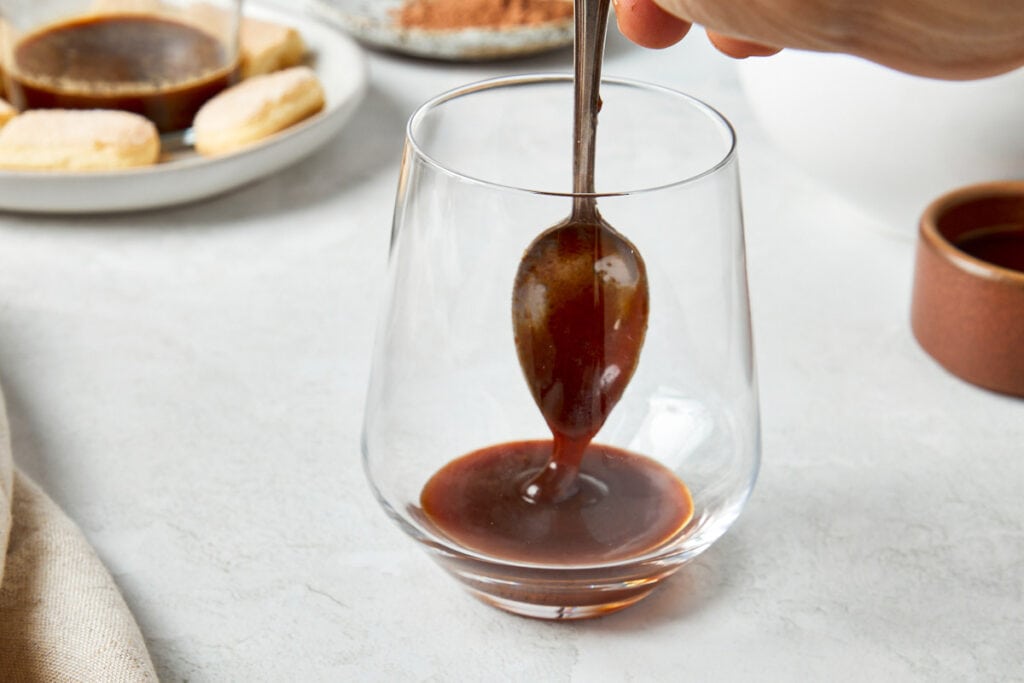 First step of layering with a spoonful of thick coffee toffee.