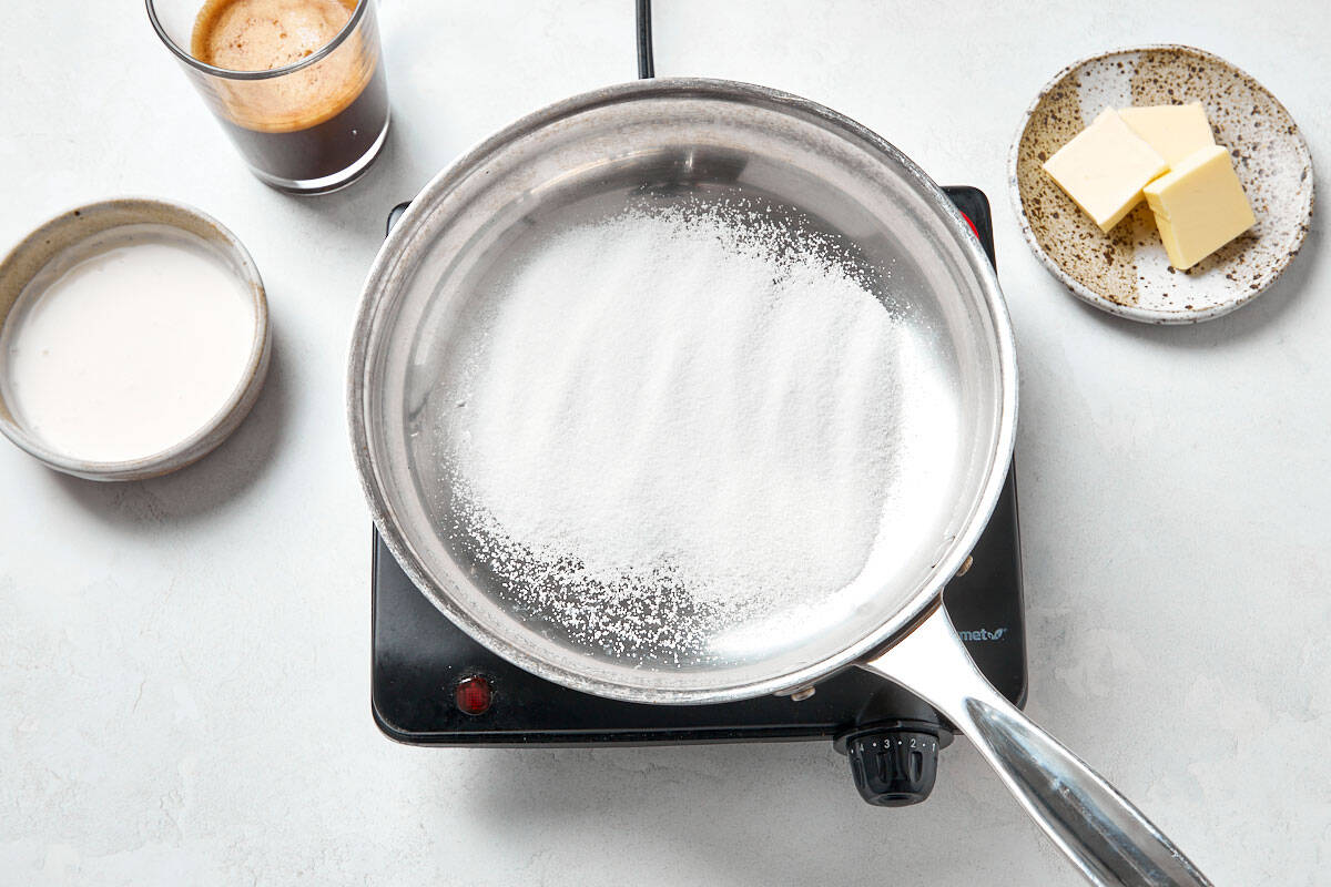 Melting sugar in a saucepan.