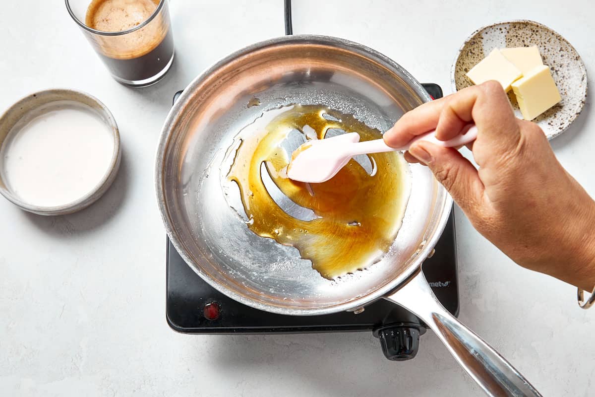 Warming heavy cream in a pan.