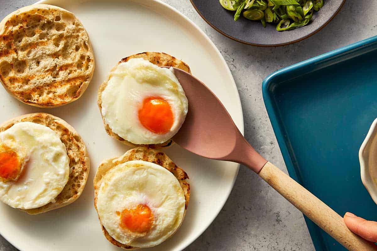 Poached eggs being served in a toast