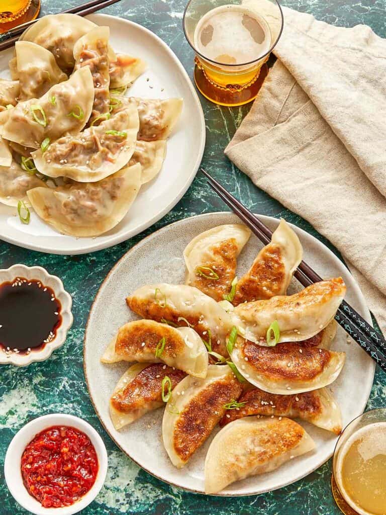 Chinese dumplings with dipping sauce.