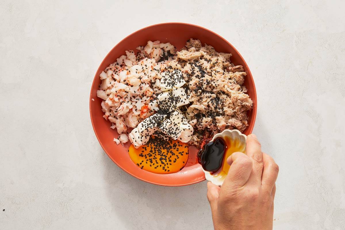 Spoon poised over a bowl of food.