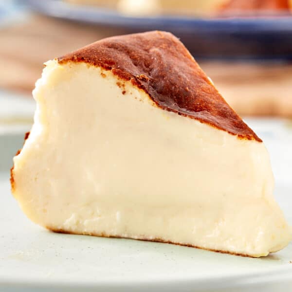 Close-up slice of Basque cheesecake with creamy center and caramelized