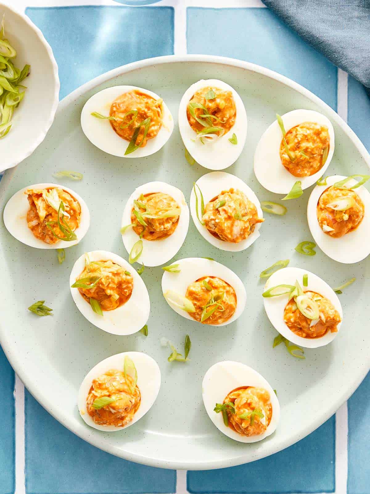 Overhead of buffalo chicken deviled eggs on a platter.