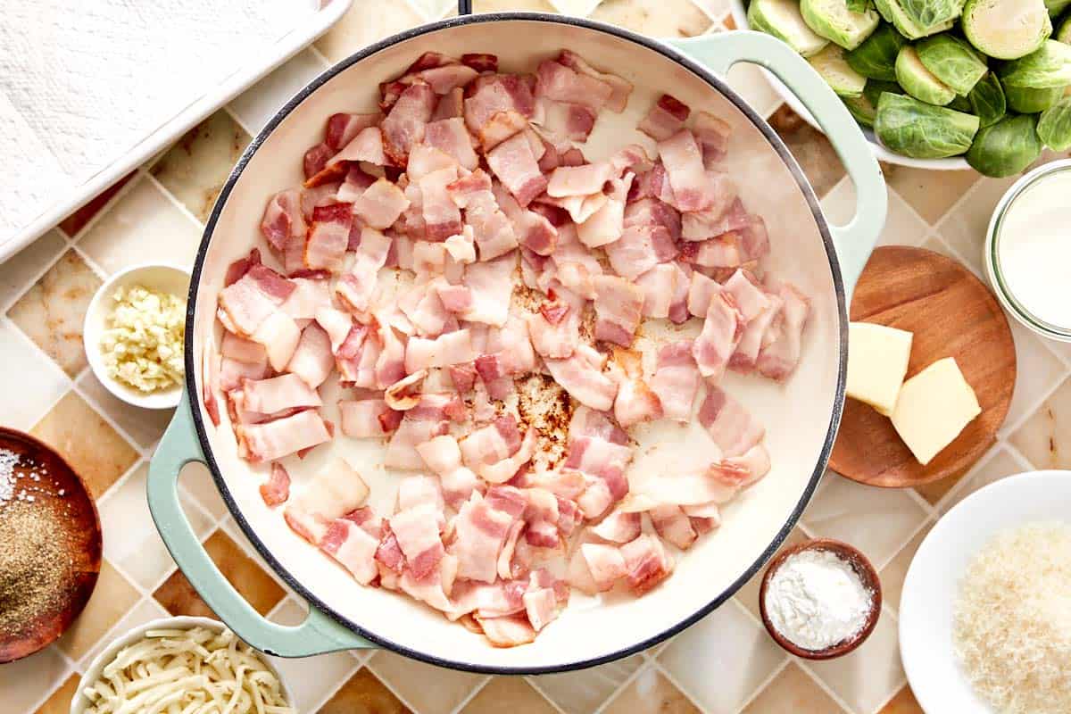 Raw bacon pieces in a skillet before cooking