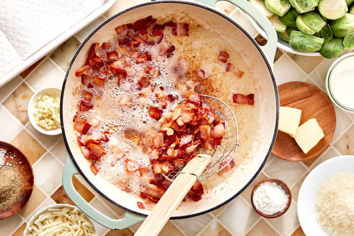 Crispy bacon cooking in a skillet