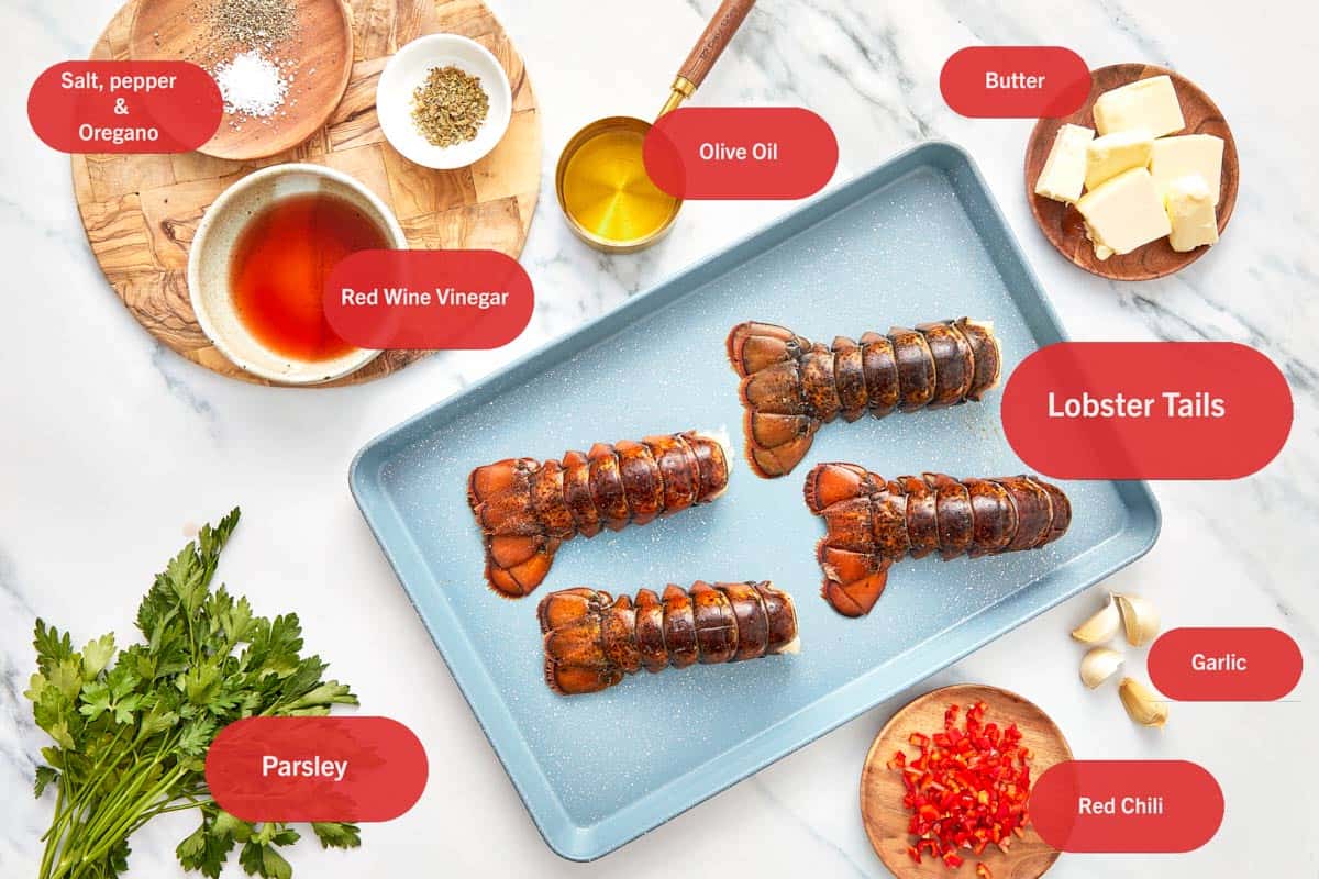 Ingredients for Chimichurri Lobster Tails laid out on a white surface.