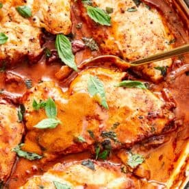 Creamy Marry Me Chicken simmering in a skillet, garnished with fresh basil and ready to serve. - 10