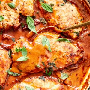 Creamy Marry Me Chicken simmering in a skillet, garnished with fresh basil and ready to serve.