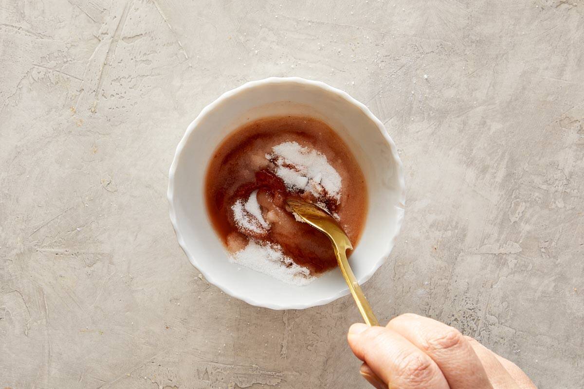 Small bowl with sweet & sour sauce ingredients being mixed.