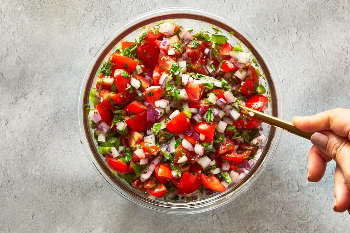 Bowl of fresh pico de gallo with tomatoes, onion, and cilantro