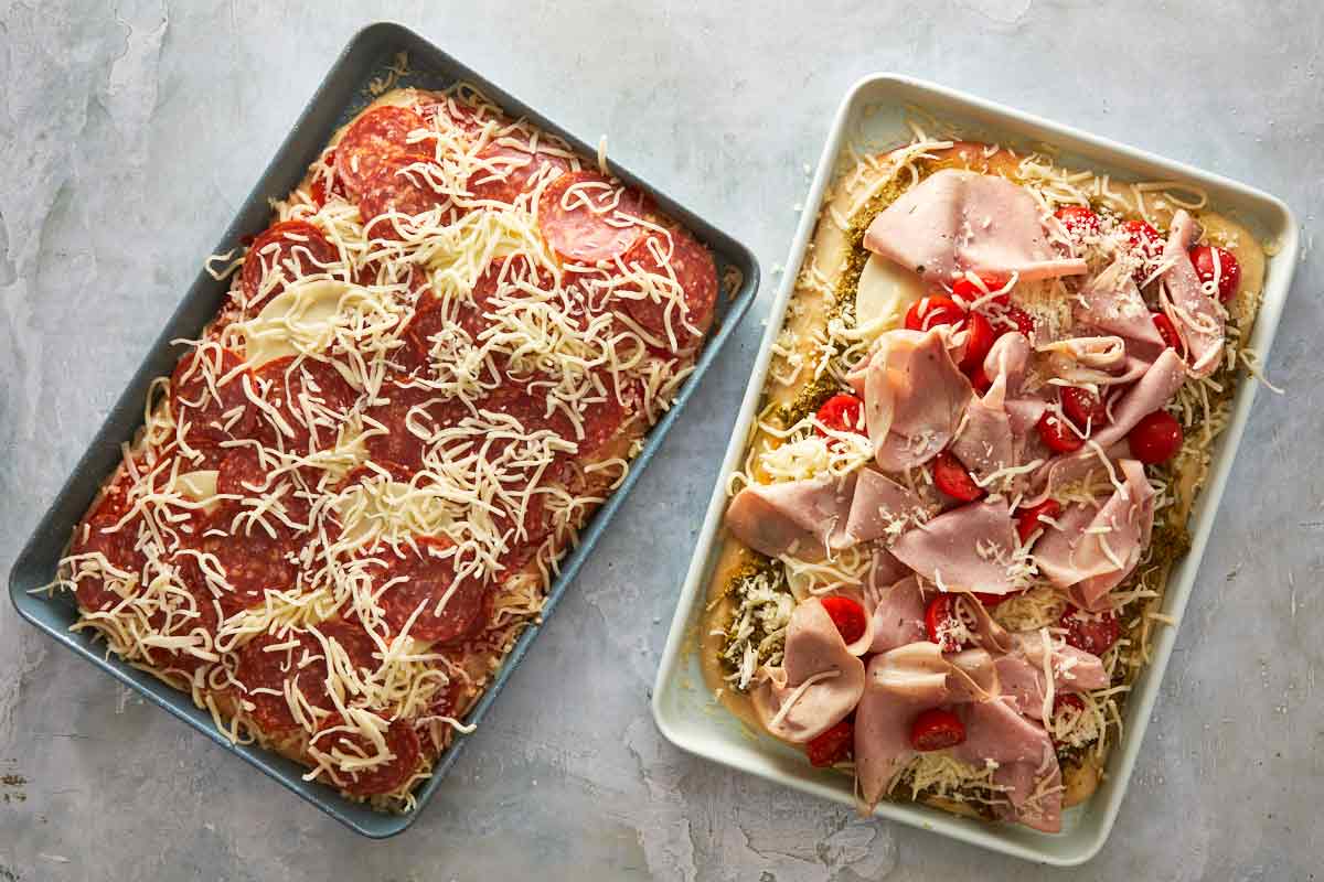 Both focaccia pizzas side by side before baking.