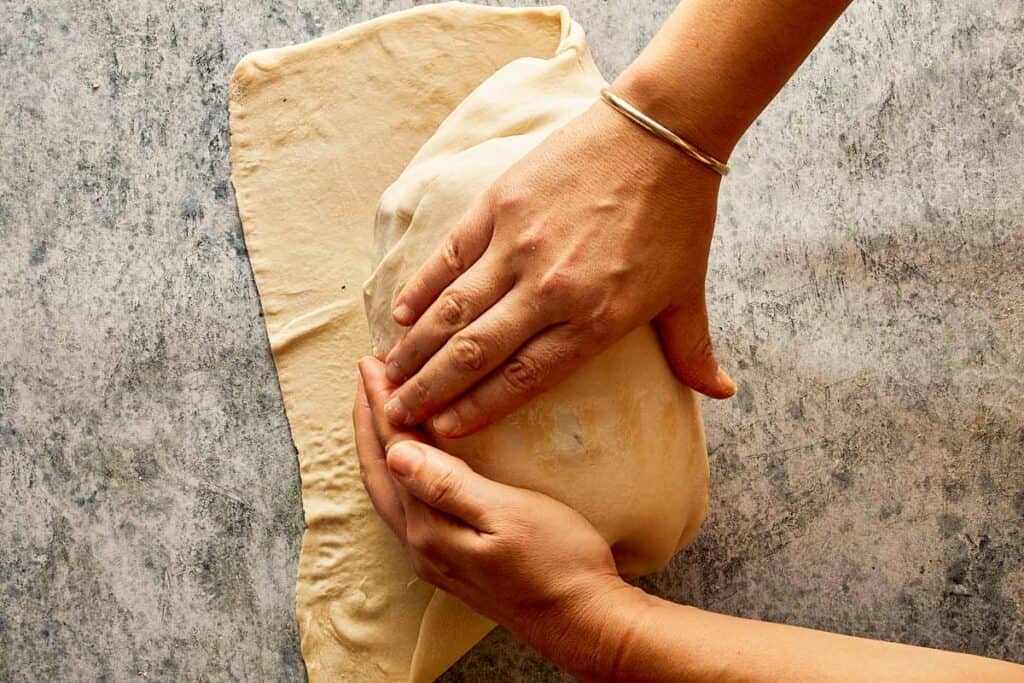 rolling the beef in pastry