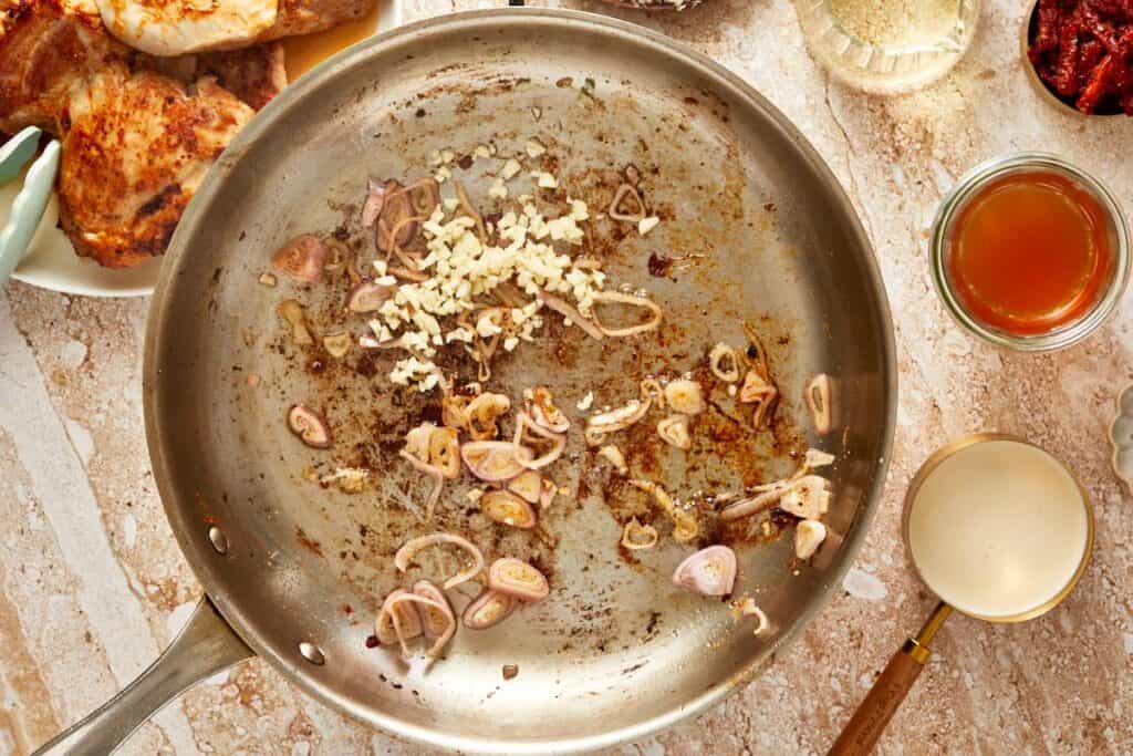 a pan with a few ingredients being fried on a benchtop