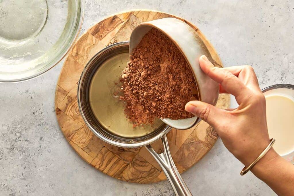 chocolate mix being poured into the gelatin water