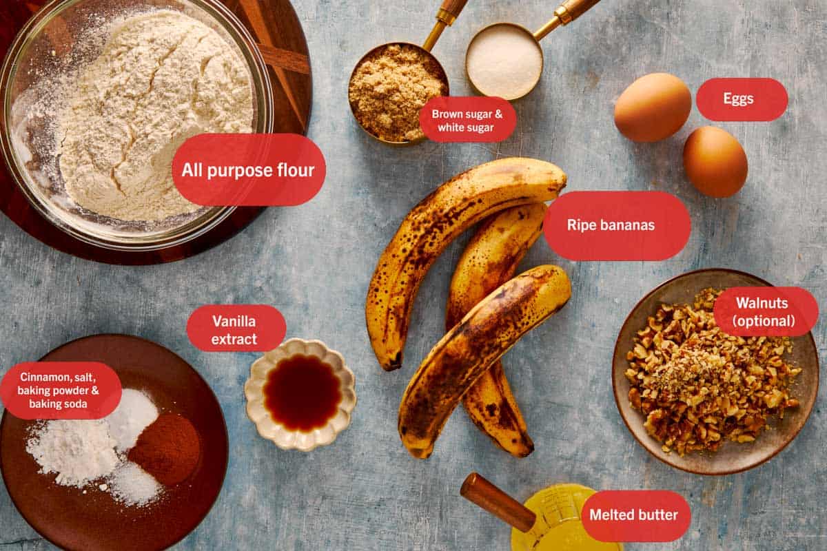 a top down view of all the ingredients needed to make banana bread resting in bowl on top of a grey bench - 2