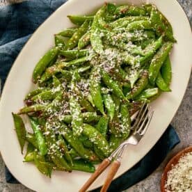 overview top of served cacio e pepe with sugar snap peas - 11
