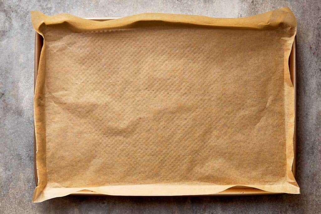 a top down view of a tray lined with baking paper