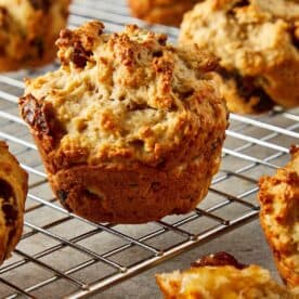 a side view of a muffin on a wire rack cooling - 15