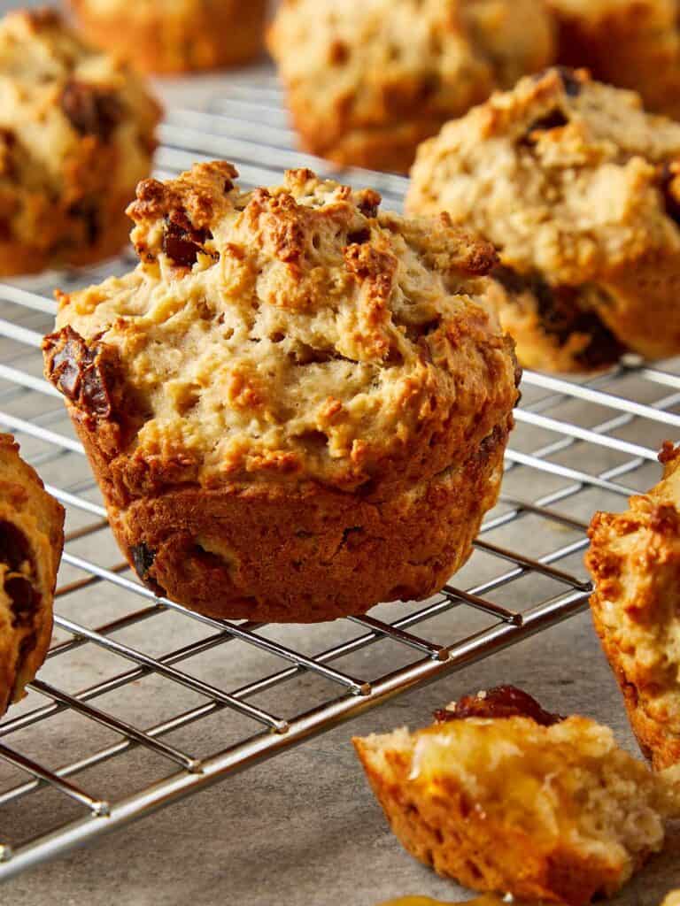 a side view of a muffin on a wire rack cooling
