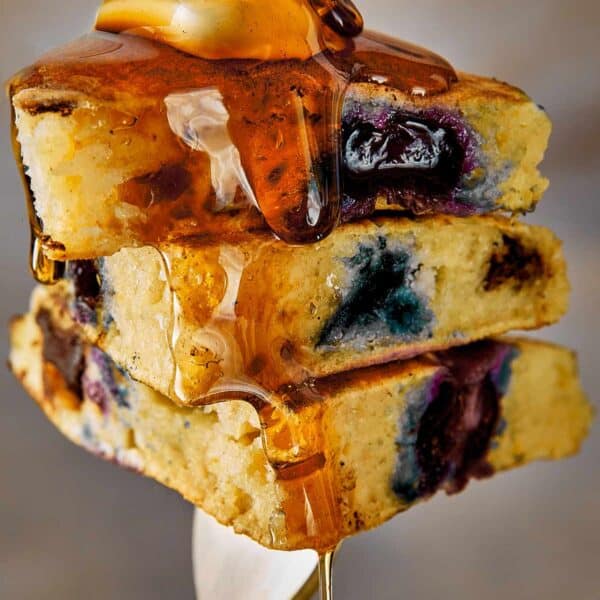 Close Up Blueberry Pancakes being hold by a fork