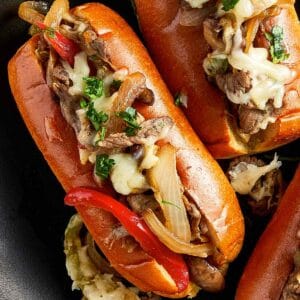 Overview top of Philly Cheesesteak in a dark surface