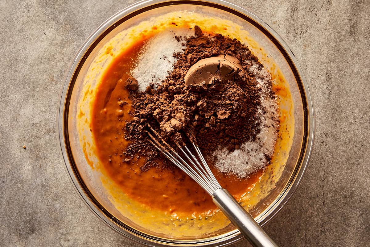 Overview top of bowl with sweet potato peanut butter, maple syrup, cocoa, splenda and eggs