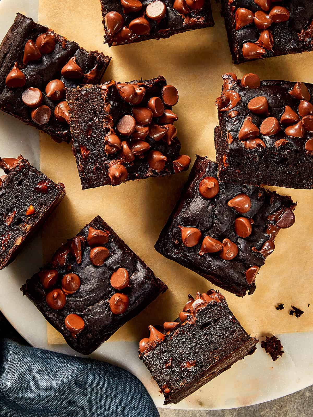 Top view of pieces of Sweet Potato brownies in a beige table