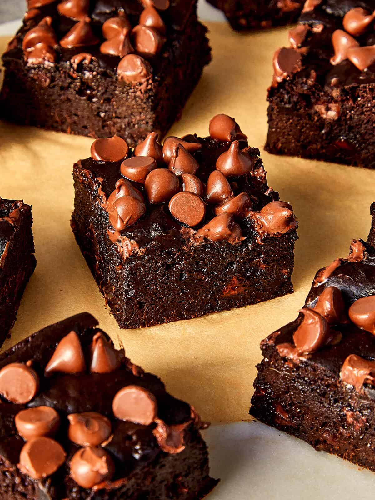 Close view of pieces of Sweet Potato brownies in a beige table