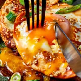 Teriyaki Poached egg being cut in a toast