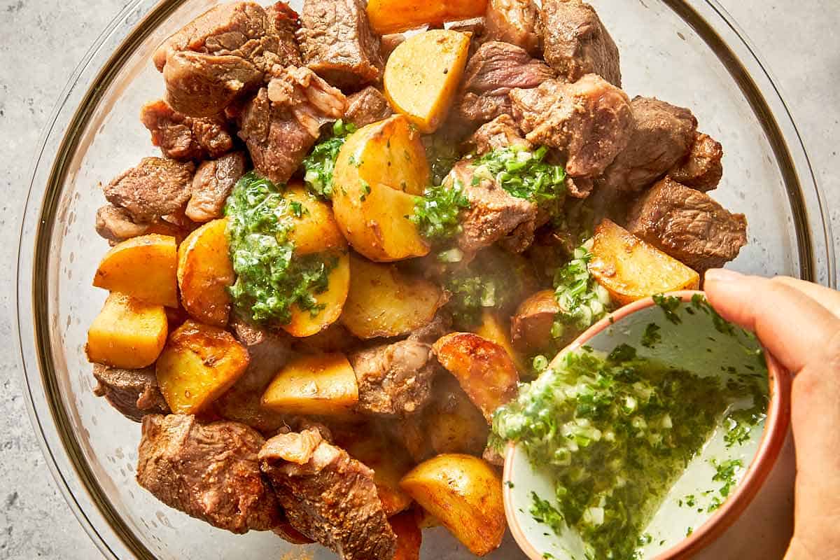 Air fryer steak bites and roasted potatoes topped with garlic butter sauce