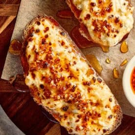 Close view of cottage toast with cottage cheese, crispy chilli oil and hot honey