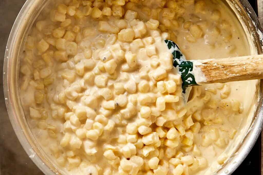Creamy corn simmering in a rich sauce, thickened