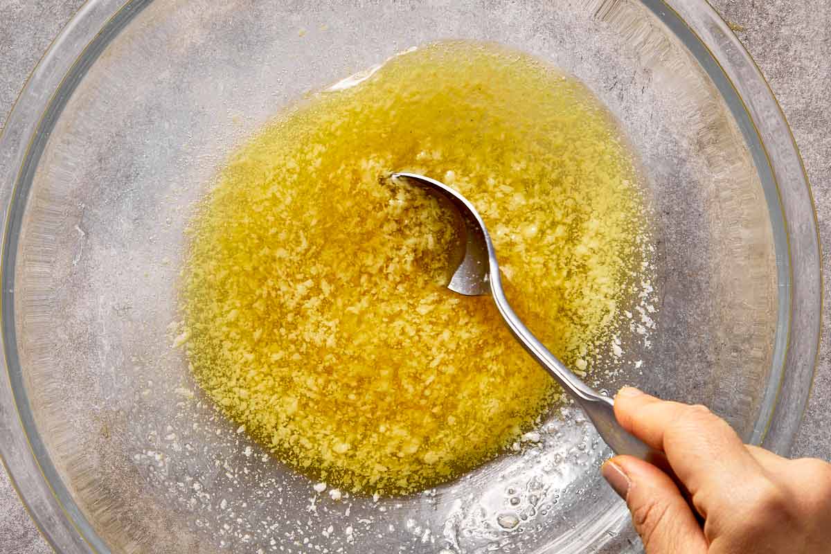 garlic butter sauce in bowl ready for tossing chicken wings