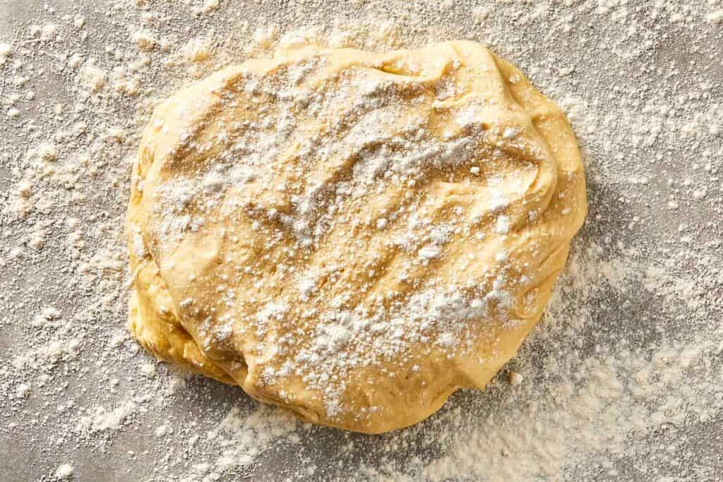 Dough placed on a floured surface ready to roll