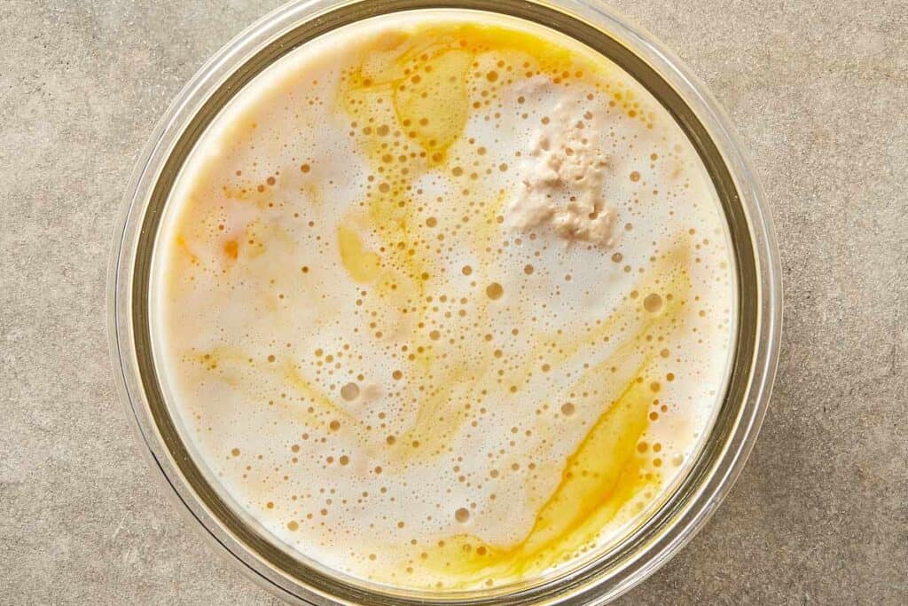 Yeast mixture and eggs combined in a bowl