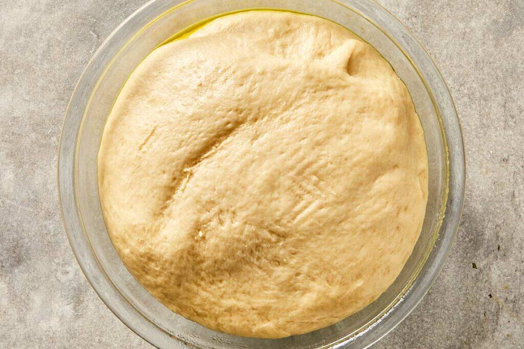 Dough after rising, doubled in size in the bowl