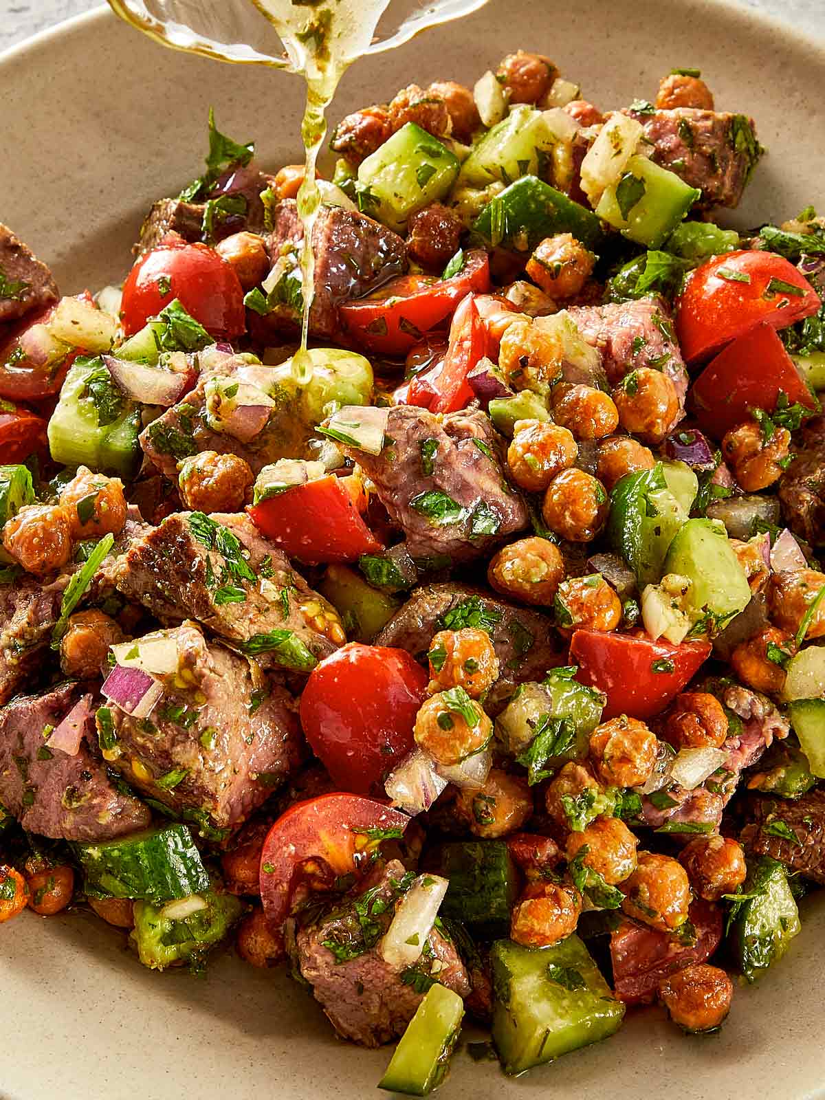 Close view of Steak and chickpea salad with chimichurri