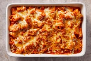 Baked tomato soup mac and cheese topped with melted cheese, golden and slightly crisp on top while staying creamy underneath.