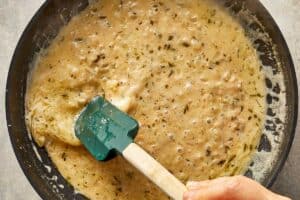 Parmesan melting into the sauce with browned butter and shallots, creating a smooth and creamy texture.